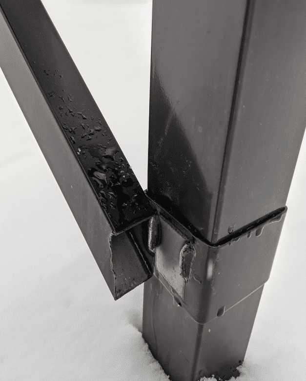 Broken mailbox arm after plow hit