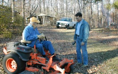 Grandpa  on Scag next to Dad